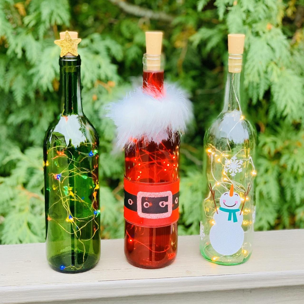 christmas wine bottle decor Holiday Wine Bottle Decorations With Lights Santa Snowman Etsy Wine bottle crafts christmas