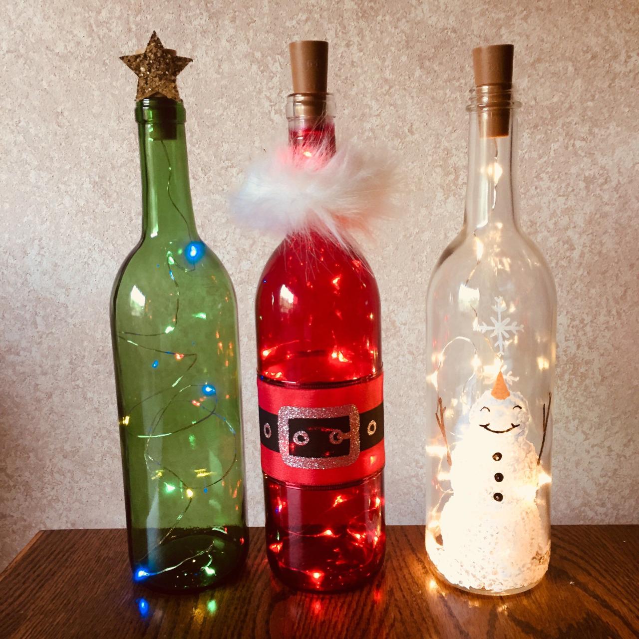 christmas decor with wine bottles Holiday Wine Bottle Decorations With Lights Santa Snowman Etsy Wine bottle crafts christmas