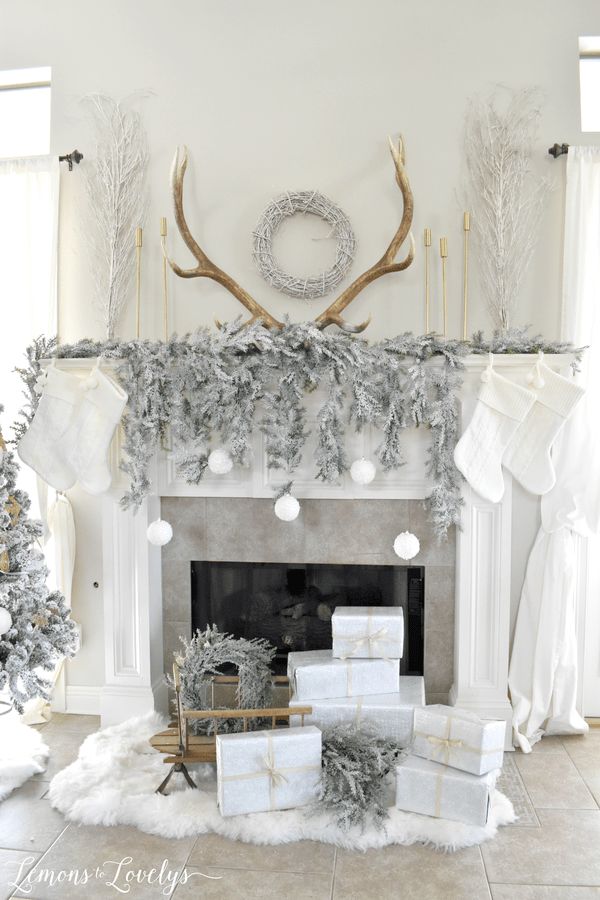 white christmas mantel decor a christmas mantel with presents and deer antlers