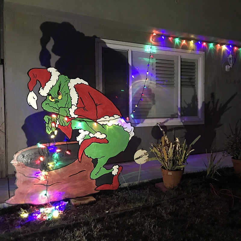 the grinch christmas decor outside This Grinch Stealing Christmas Lights Decor is So Clever, It's Sneaky!