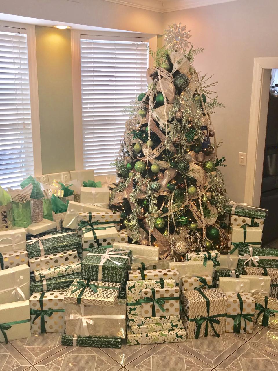 christmas decor green and gold Holiday Christmas tree with presents. Green, emerald green, gold, white