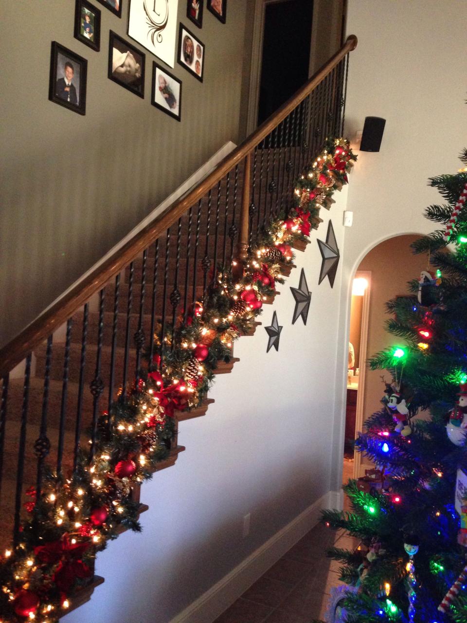 christmas decor ideas on stairs Love the garland at bottom of banister to keep hand rail free for kids