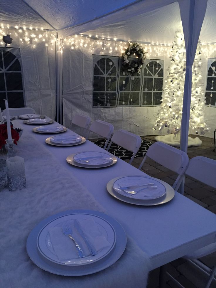 christmas decorations outdoor party Outdoor tent. Christmas party table settings for a Winter Wonderland