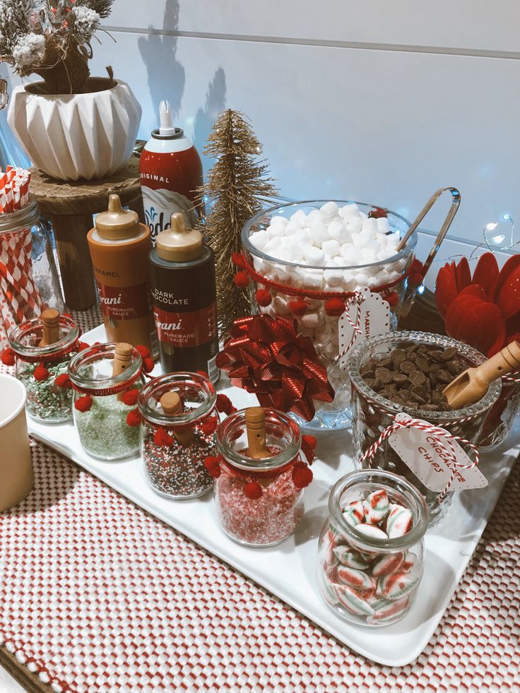 hot chocolate bar christmas decor an assortment of candy and hot chocolates displayed on a serving