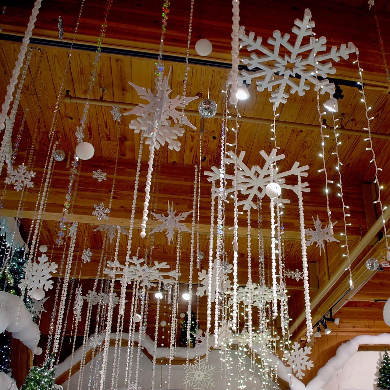 diy christmas decor hanging from ceiling Snowflakes and twinkling lights hang from the ceiling above Bronner's