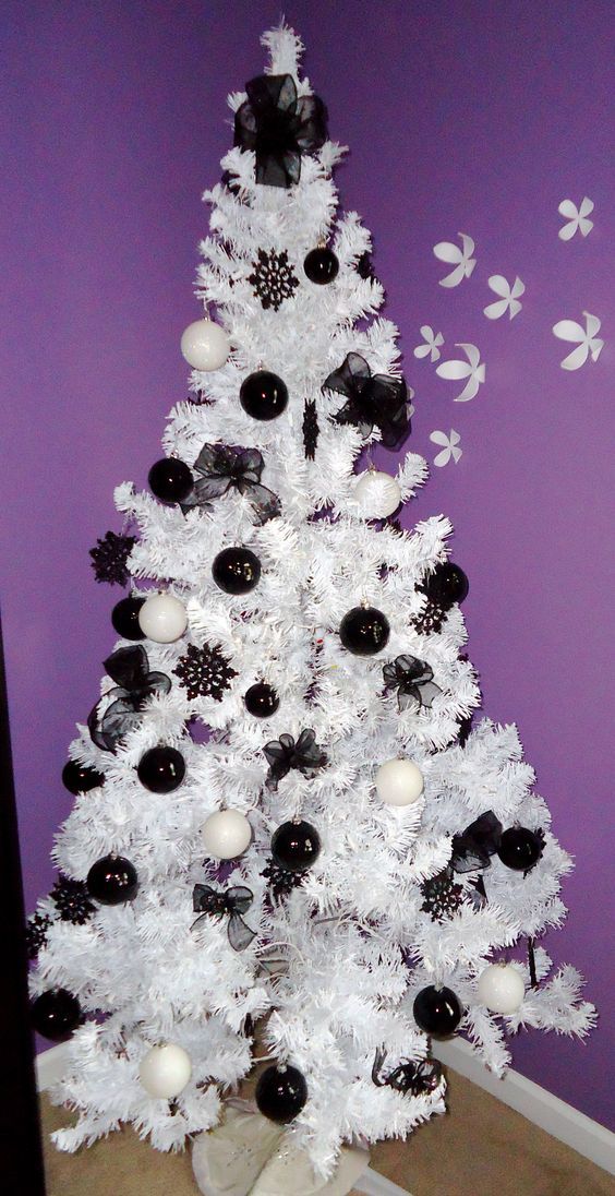 christmas black and white decor Black and white balls hanging on white Christmas tree. White