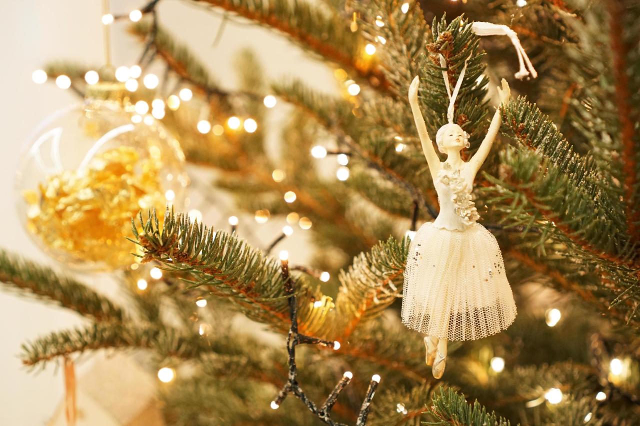 ballerina outdoor christmas decor Beautiful ballerina decorates a Christmas tree branch 3280336 Stock